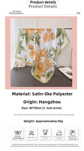Detalle de bufanda de seda con estampado de rosas amarillas y costuras finas de satén