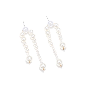 Detail view of Baroque imitation pearl drop earrings with elegant gold-tone metal links