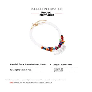 Detail of layered bohemian necklace with imitation pearls, colorful stones, and resin