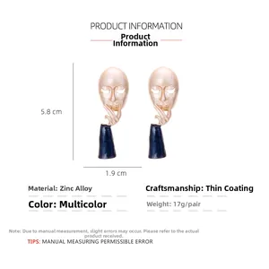 Abstract face drop earrings in zinc alloy showing 5.8x1.9cm dimensions and 17g weight