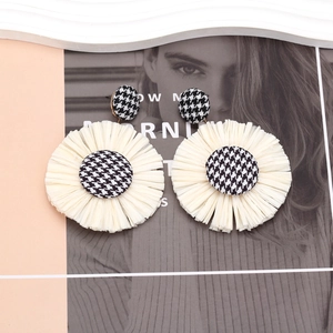Handwoven raffia flower earrings with houndstooth fabric buttons in bohemian style
