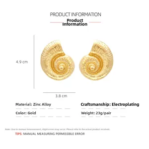 Detailed view of oversized golden conch earrings with 4.9cm by 3.8cm size measurements