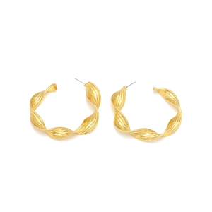 Vintage gold twisted metal C-shape hoop earrings with textured hammered finish
