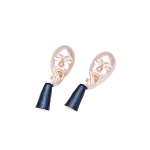 Artistic abstract face earrings with pearlescent finish and blue conical drops
