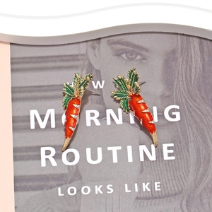 Cute carrot stud earrings with orange enamel and green rhinestone leaves in gold finish