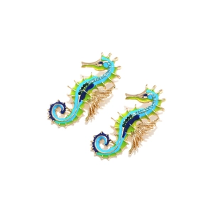 Colorful seahorse drop earrings with blue green enamel and sparkling rhinestones