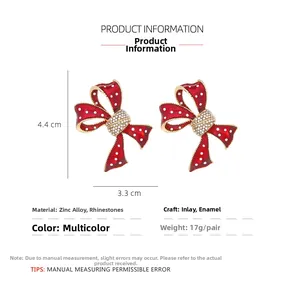 Détails des boucles d'oreilles nœud à pois rouges avec cristaux et dimensions