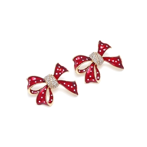 Boucles d'oreilles nœud rouge à pois avec cristaux brillants et finition dorée