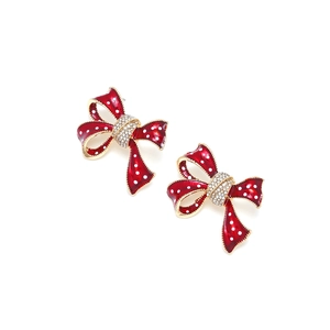 Boucles d'oreilles nœud en émail à pois avec cristaux brillants et bords dorés