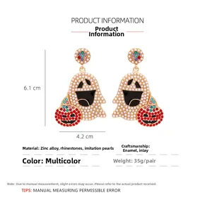 Detailed view of Halloween ghost and pumpkin earrings with pearls and rhinestones