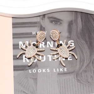 Gothic gold spider drop earrings with sparkling rhinestones and white pearls
