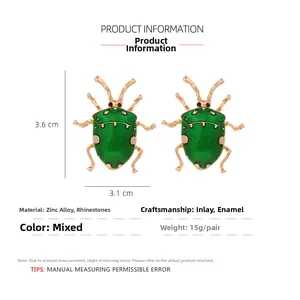 Detail view of green beetle earrings with dimensions 3.6cm by 3.1cm and 15g weight