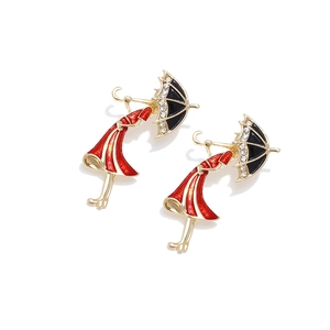 Modern girl with umbrella earrings in red enamel and gold finish with crystals