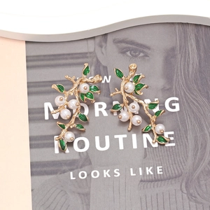 Vintage gold branch earrings with green enamel leaves and white imitation pearls