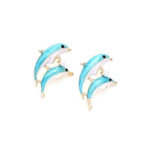 Cute dolphin stud earrings with light blue enamel, white pearls, and gold metal accents