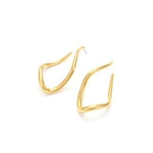 Detail of twisted irregular gold hoop earrings with polished wavy metal design