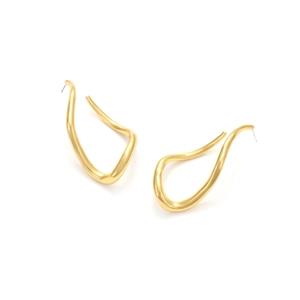 Close-up of golden irregular wavy stud earrings with elegant matte satin finish