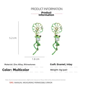 Detailed view of frog earrings with 5.2cm height and 1.8cm width dimensions