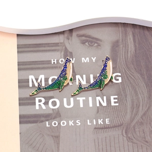 Chic gold-plated whale stud earrings with colorful enamel gradient on artistic background