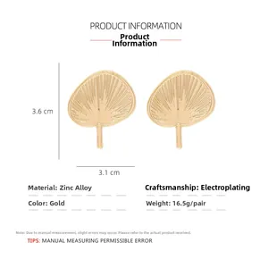 Detail view of fan-shaped gold alloy earrings with 3.6cm height and 3.1cm width dimensions
