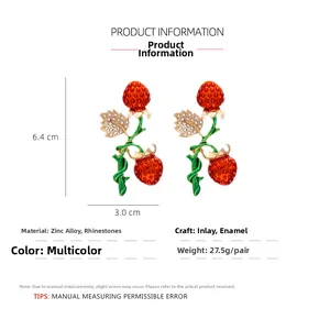 Detail view of strawberry earrings with dimensions 6.4cm by 3.0cm and weight 27.5g