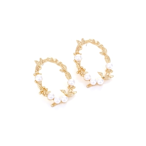 Vintage gold oval bird and leaf earrings with faux pearls on white background