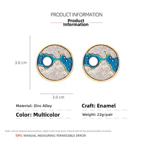 Detailed view of 3cm round star and moon earrings with blue enamel drip oil pattern