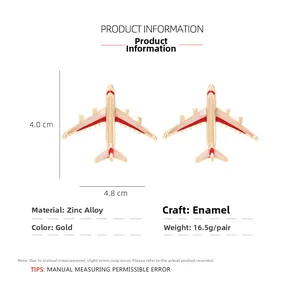Detail view of 4.0cm x 4.8cm gold alloy airplane earrings with red enamel coating