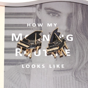 Artistic piano-shaped alloy drop earrings with black enamel and gold-plated details