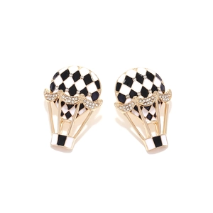 Golden hot air balloon earrings with black and white checkerboard enamel and crystal inlay