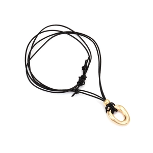 Modern irregular gold circular pendant on black multi-strand cord necklace