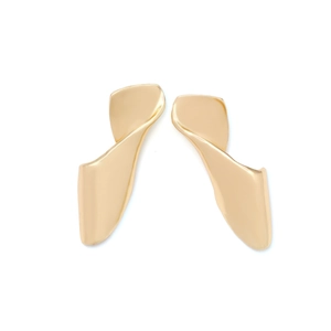 Close-up of golden irregular twisted geometric stud earrings with polished metallic finish