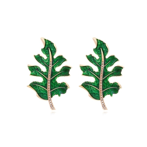 Elegant gold leaf earrings with green enamel coating and white rhinestone accents