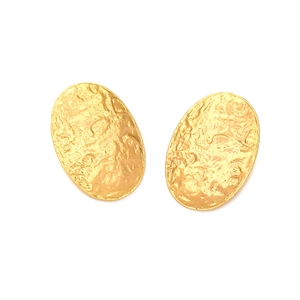 Statement oval earrings with hammered gold texture and vintage embossed artistic style