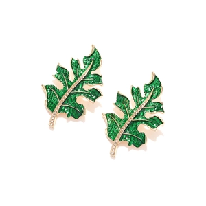 Detailed view of green enamel leaf earrings with gold mesh texture and rhinestone inlay
