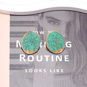 Retro forest oval stud earrings with gold trim and green enamel landscape design