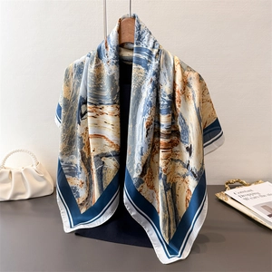 Elegant oil painting style silk scarf with abstract patterns hanging on a wooden hanger