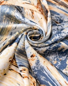 Macro detail of silk scarf texture with oil painting abstract print and satin sheen