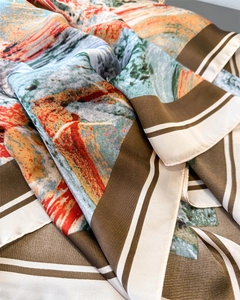 Detail of oil painting style satin scarf showing artistic prints and smooth texture