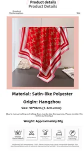 Macro detail of red satin silk scarf featuring gold chain patterns and 90x90CM size
