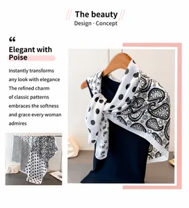 Detail of silk-like satin scarf featuring classic black and white paisley and polka dots