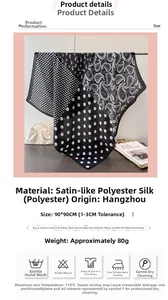 Detail view of paisley and polka dot silk-satin scarf measuring 90x90cm in black and white