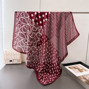 Luxurious wine red paisley silk scarf featuring polka dots and bohemian patterns