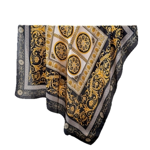 Elegant baroque style silk scarf with gold and black floral patterns on white background