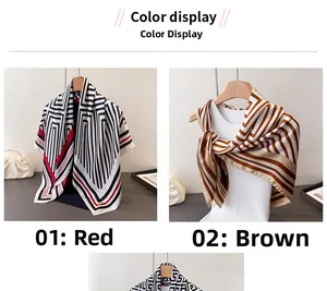 Detail view of geometric silk scarves in red and brown stripes on wooden hangers
