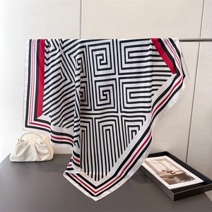 Elegant satin square scarf with black and white geometric pattern and red border