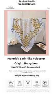 Detail view of floral satin scarf 90x90cm with yellow patterns and texture specifications