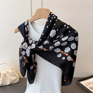 Elegant black satin scarf with white camellia flowers, dots, and gold chain print for women
