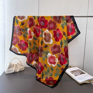 Floral print silk-like square scarf in yellow and red with black borders