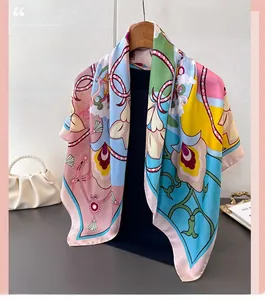Detailed view of colorful floral pattern silk scarf draped elegantly with accessories